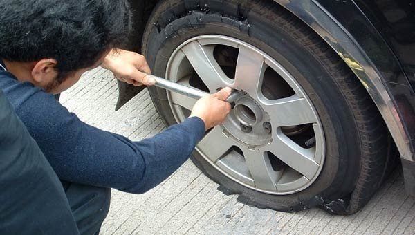 HOW DO I CHANGE A TIRE?